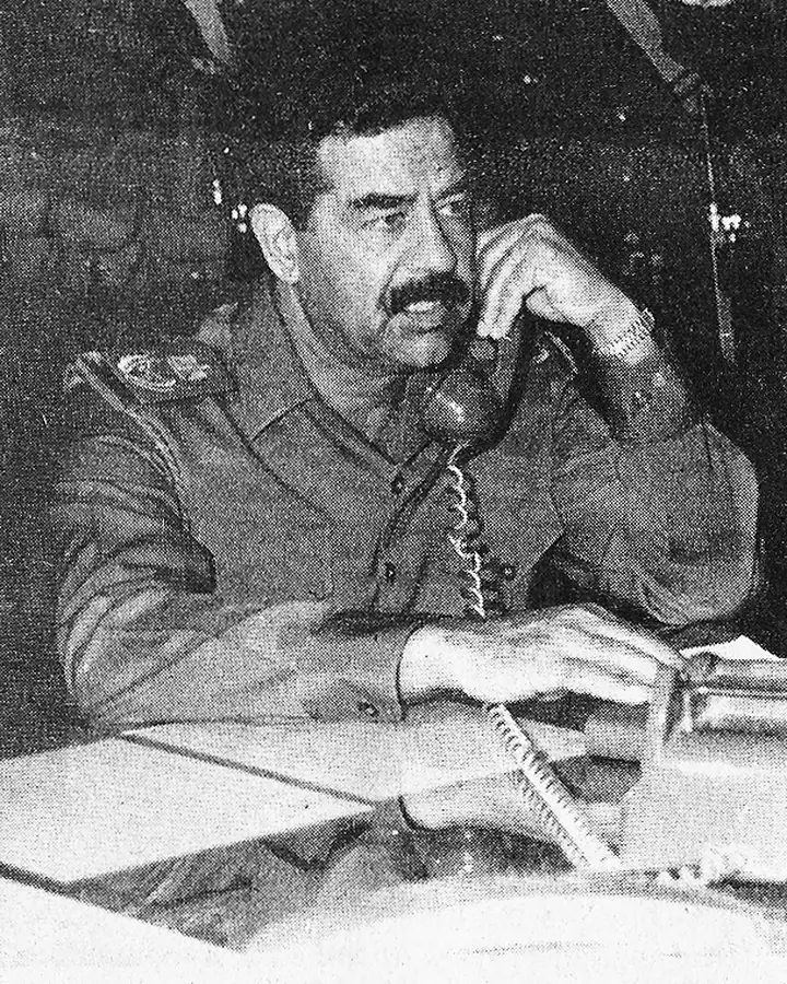 Saddam Hussein on the telephone at a frontline command, 1988